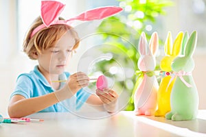 Kids on Easter egg hunt. Children dye eggs