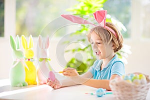 Kids on Easter egg hunt. Children dye eggs