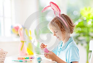 Kids on Easter egg hunt. Children dye eggs