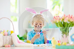 Kids on Easter egg hunt. Children dye eggs