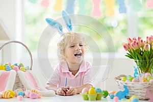 Kids on Easter egg hunt. Children dye eggs