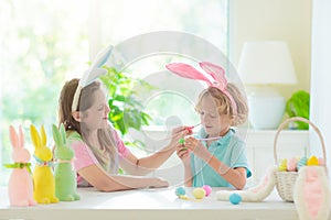 Kids on Easter egg hunt. Children dye eggs