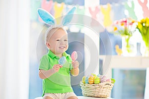 Kids on Easter egg hunt. Children dye eggs