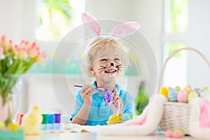 Kids on Easter egg hunt. Children dye eggs