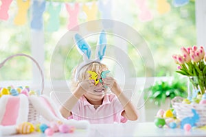 Kids on Easter egg hunt. Children dye eggs