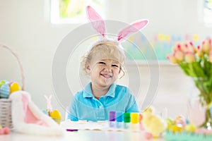 Kids on Easter egg hunt. Children dye eggs