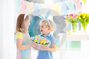 Kids on Easter egg hunt. Children dye eggs