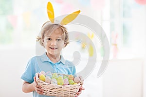 Kids on Easter egg hunt. Children dye eggs