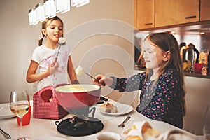 Kids eating fondue