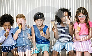 Kids eating ice cream in the summer