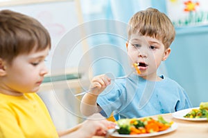 Kids eating in kindergarten