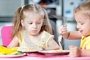 Kids eating in kindergarten or at home