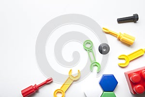 Kids educational developing toys frame on white background. Top view. Flat lay. Copy space for text