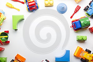 Kids educational developing toys frame on white background. Top view. Flat lay. Copy space for text