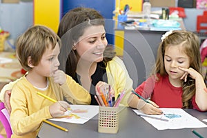 Kids and Educator Playing at Kindergarten photo