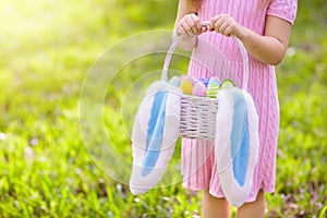 Kids with eggs basket on Easter egg hunt
