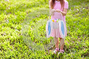 Kids with eggs basket on Easter egg hunt