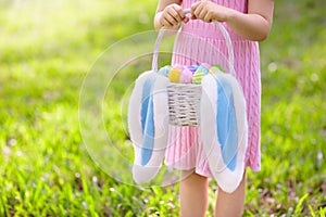 Kids with eggs basket on Easter egg hunt