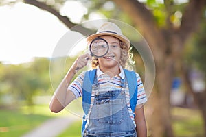 Kids explore nature. Children hike in sunny park