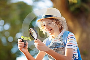 Kids explore nature. Children hike in sunny park