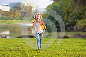 Kids explore nature. Children play in sunny park