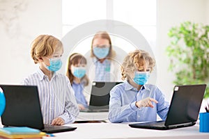 Kids in face mask. Child in school