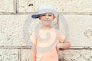Kids fashion. Lovely little boy in baseball cap. Summer holidays