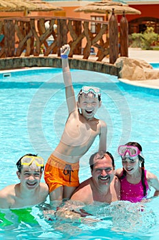 Kids and father in pool