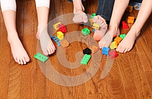 Kids feet pickup up blocks