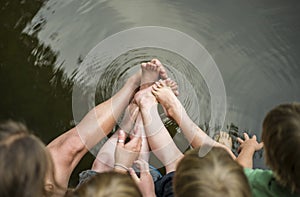 Kids with feet and toes in water