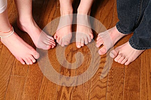 Kids feet on wood floor