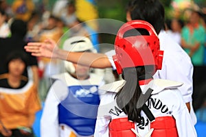 Kids fighting on stage during Taekwondo contest