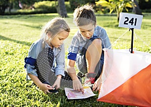 Kids finding direction on a map