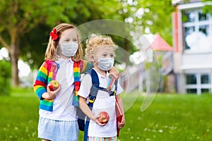 Kids on first school day in face mask