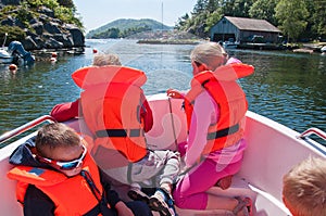 Kids floating in a boat