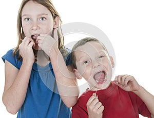 Kids flossing teeth photo