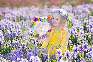 Kids with flowers and chalk board