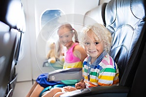 Kids flying airplane. Fligh with children.