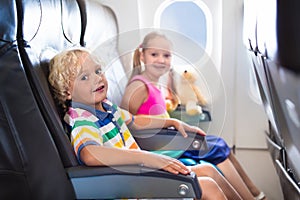 Kids flying airplane. Fligh with children.