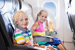 Kids flying airplane. Fligh with children.