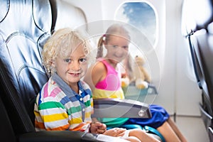 Kids flying airplane. Fligh with children.