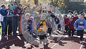 Kids fun run on a track at a turkey trot race