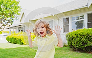 Kids funny face. Leisure and children concept. Happy kid having fun and making faces outdoors. Little boy with funny