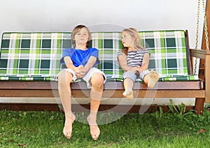 Kids on a garden swing