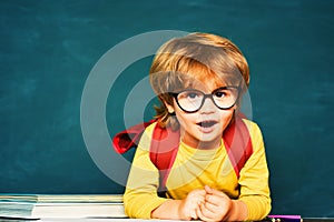 Kids gets ready for school. Learning concept. First school day. Happy smiling pupils drawing at the desk. School kids