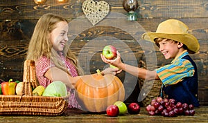 Kids girl boy fresh vegetables harvest rustic style. Fall harvest holiday. Elementary school fall festival idea