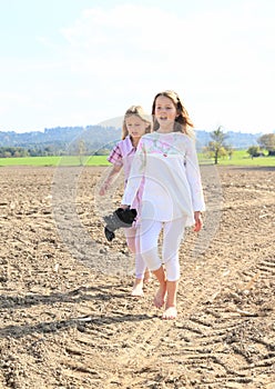 Kids - girls walking on field