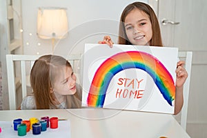 Kids girls write stay home. flashmob. rainbow photo