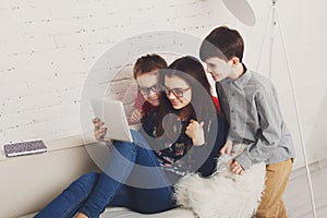 Kids in glasses with tablet, computer addiction