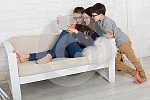 Kids in glasses with tablet, computer addiction